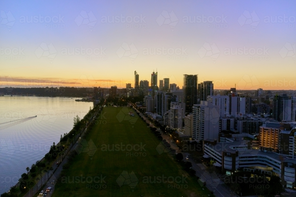 Perth City twilight aerial view with Langley Park and the Swan River in view beneath the fading sky. - Australian Stock Image