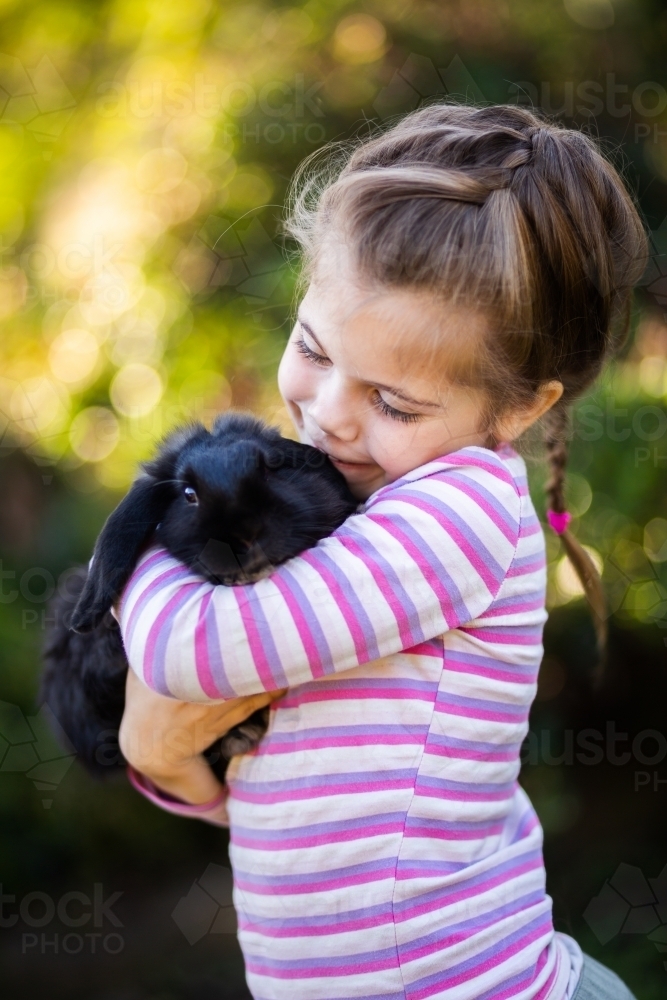 Image of Pet animal cuddles Austockphoto