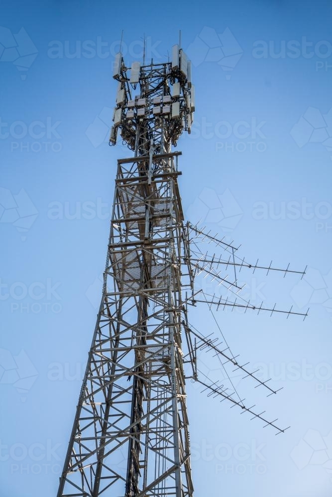Phone tower against blue sky - Australian Stock Image