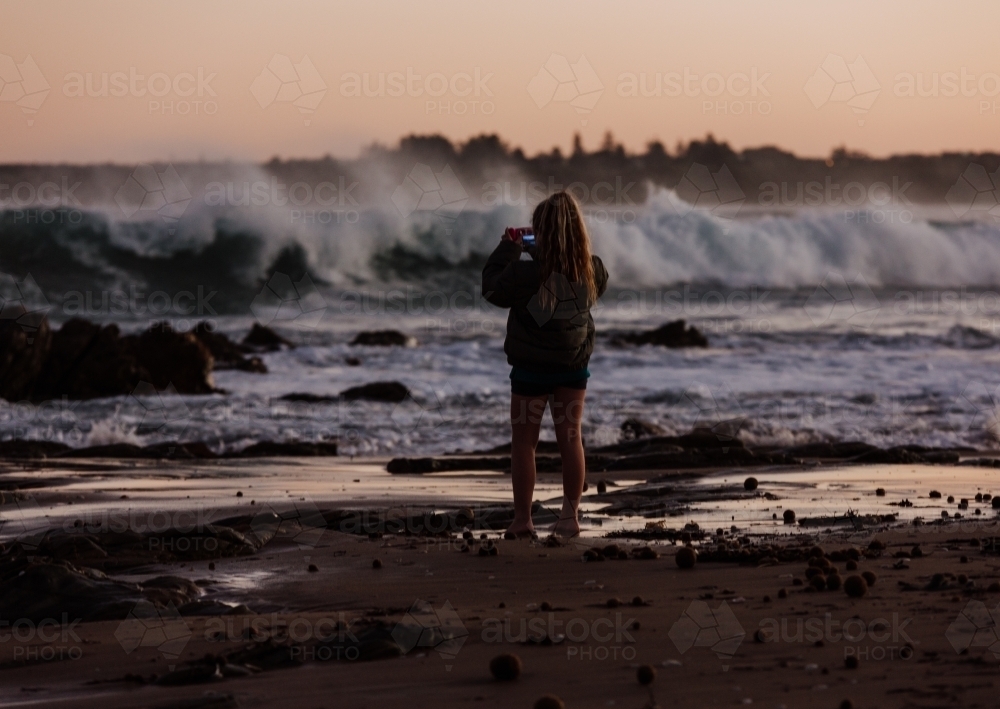 Photographing the sea at dusk - Australian Stock Image