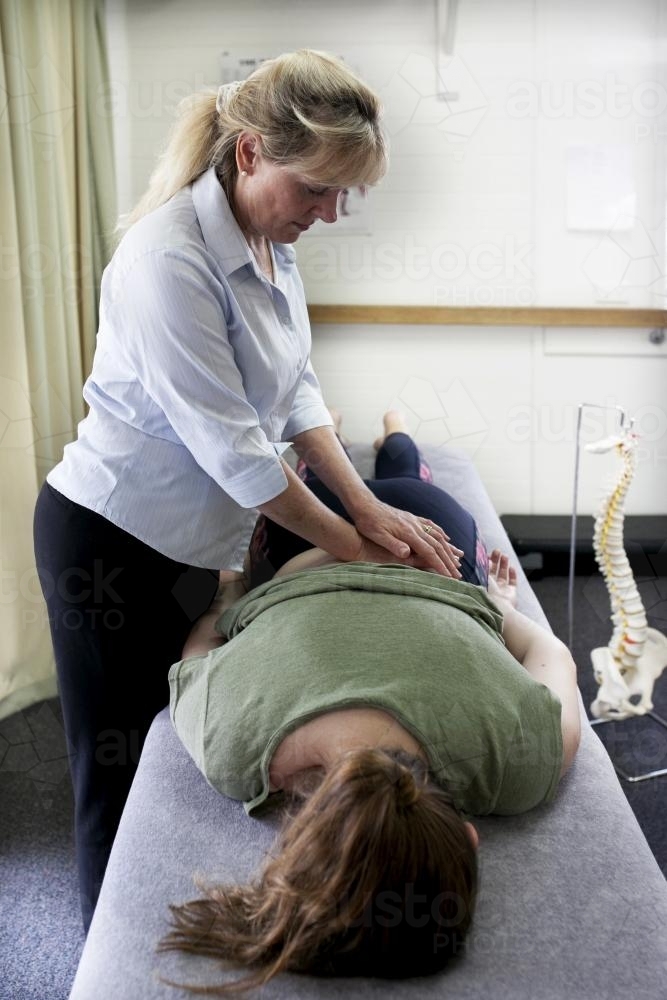 Physiotherapist treating patient - Australian Stock Image
