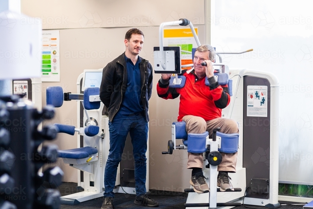 Image of physiotherapist working with client using exercise therapy ...