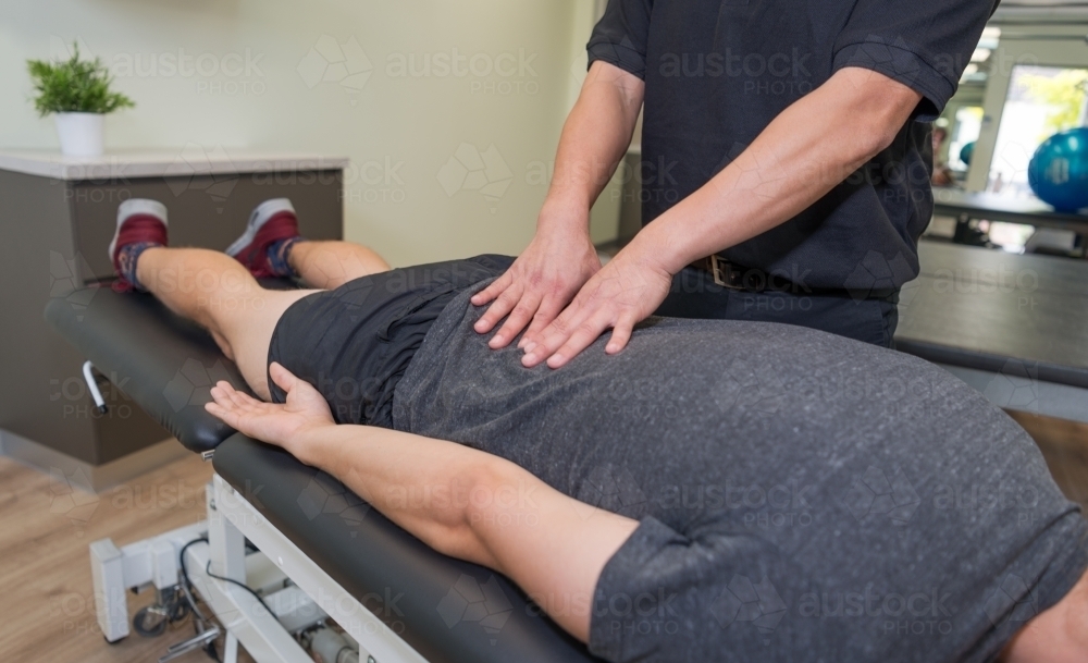 Physiotherapy practitioner and patient at clinic - Australian Stock Image