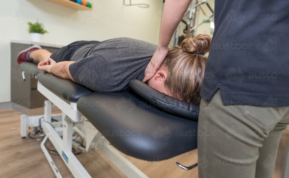 Physiotherapy session with practitioner and patient - Australian Stock Image
