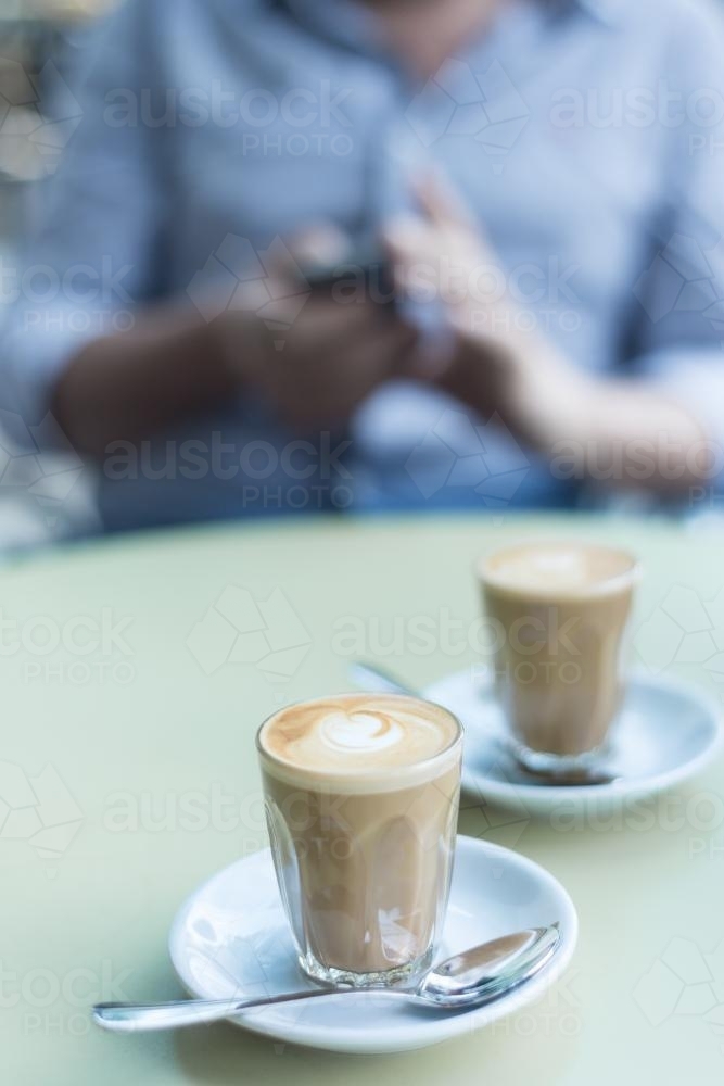 Piccolo latte coffees on a table at a cafe in the morning - Australian Stock Image