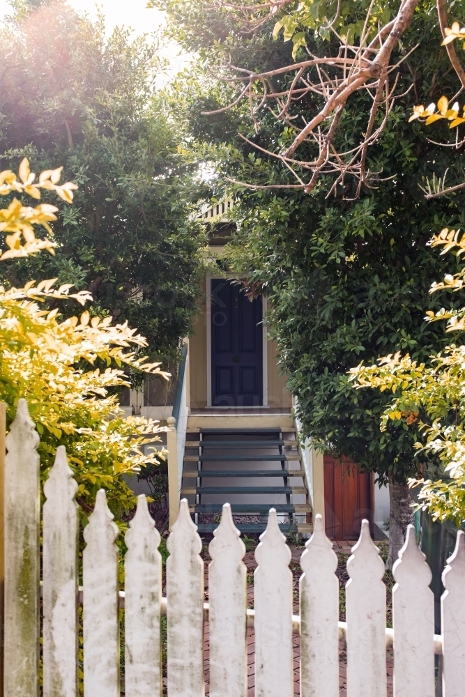 picket fence and front door of Queenslander house in Brisbane, Australia - Australian Stock Image