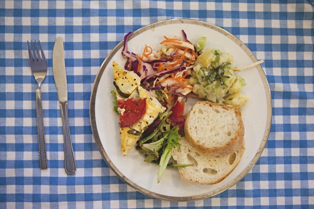 picnic lunch on check tablecloth - Australian Stock Image