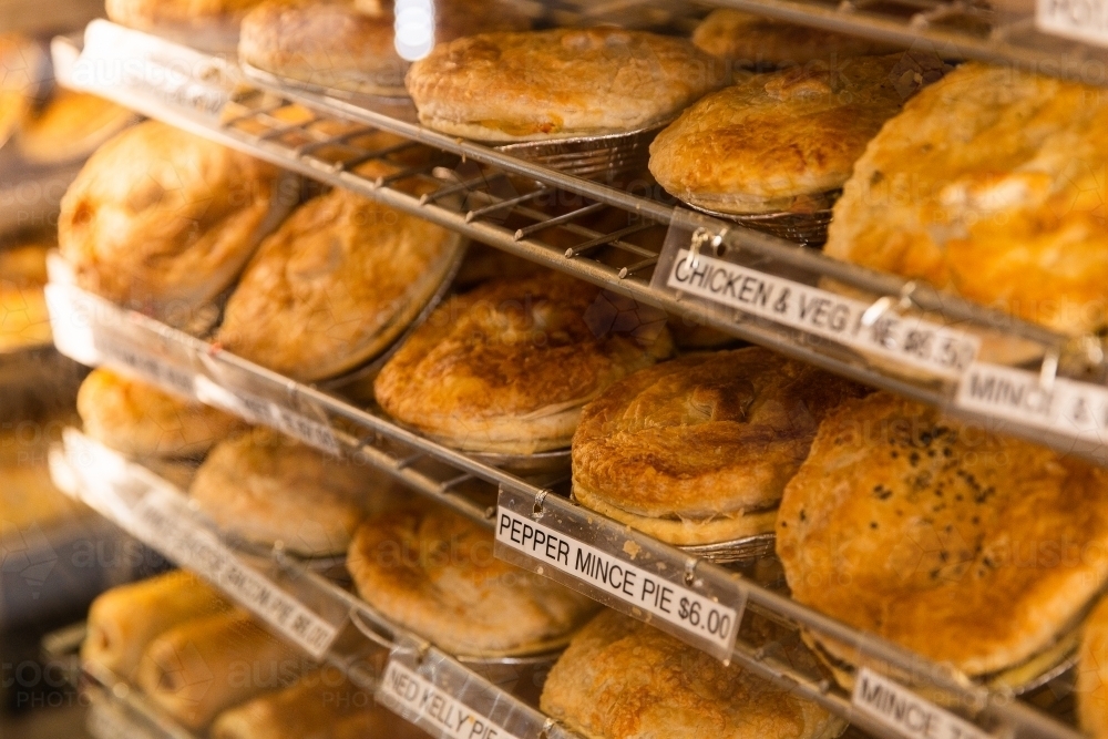 pies and sausage rolls filling a display cabinet : Austockphoto pies and sausage rolls filling a display cabinet - Australian Stock Image
