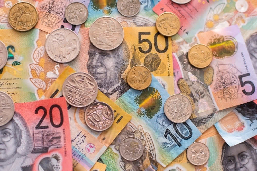 Image of pile of Australian notes and coins background - Austockphoto