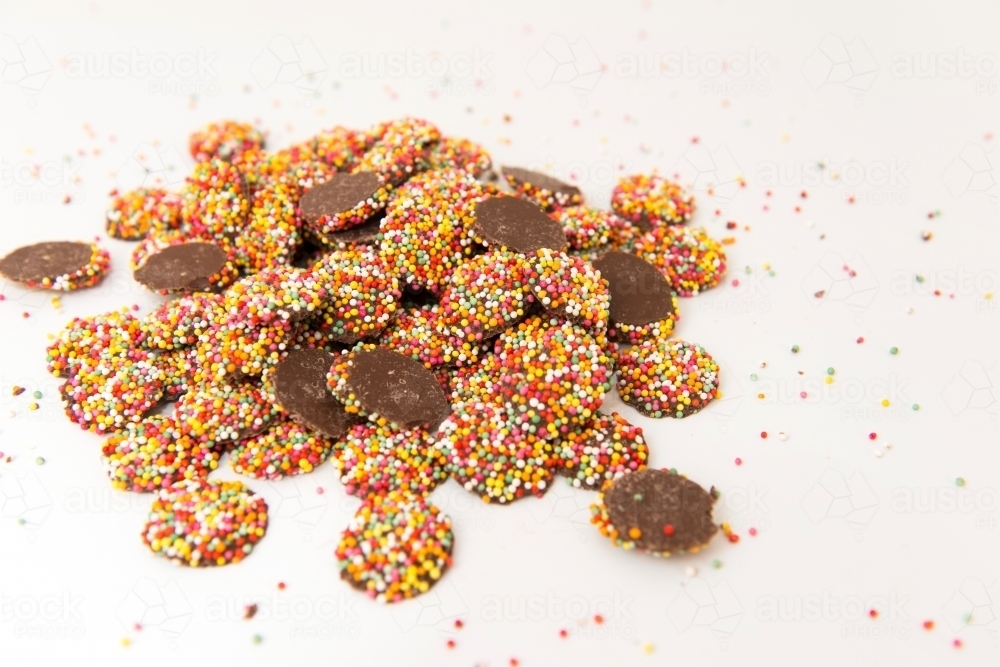 Pile of chocolate freckles with sprinkles - Australian Stock Image