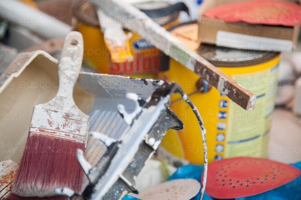 Pile of tradie painters equipment and paintbrush - Australian Stock Image