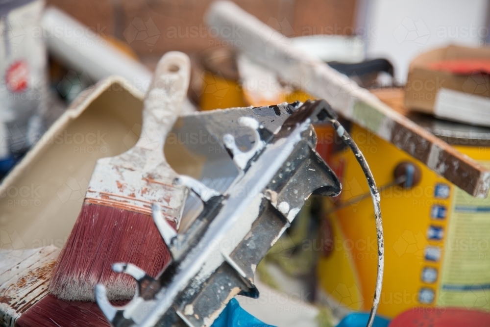 Pile of tradie painters equipment and paintbrush - Australian Stock Image