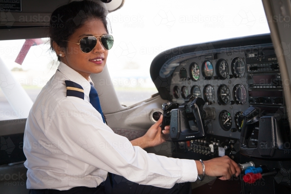 Pilot at the Controls of Her AIrcraft - Australian Stock Image