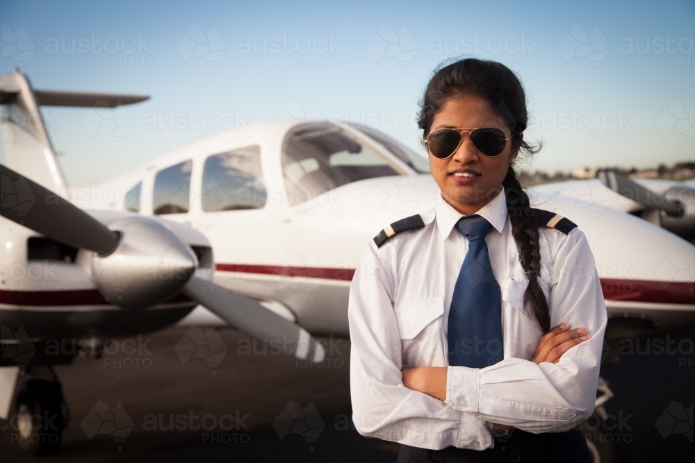 Pilot Standing Alongside Her Small Aircraft - Australian Stock Image