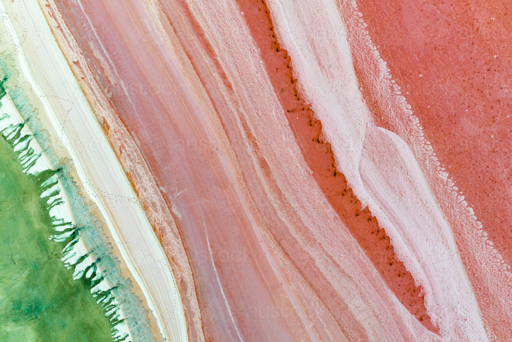 Pink and green salt lake patterns viewed from above. - Australian Stock Image