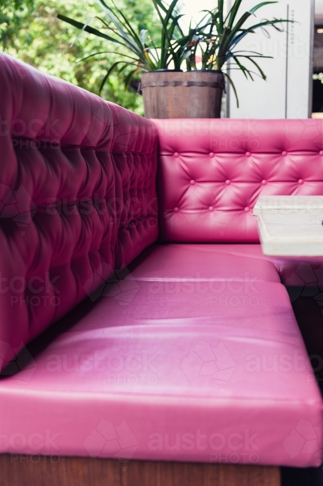 Image of pink vinyl booth with no people Austockphoto