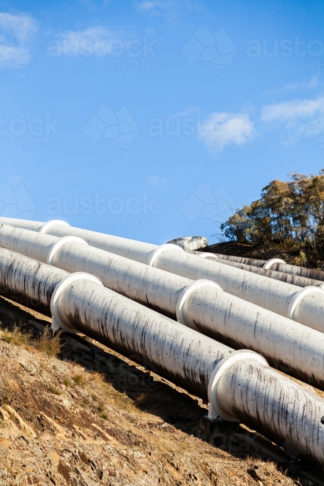 Pipes going down hill to Tumut 3 Power Station part of the snowy mountains hydroelectric scheme - Australian Stock Image