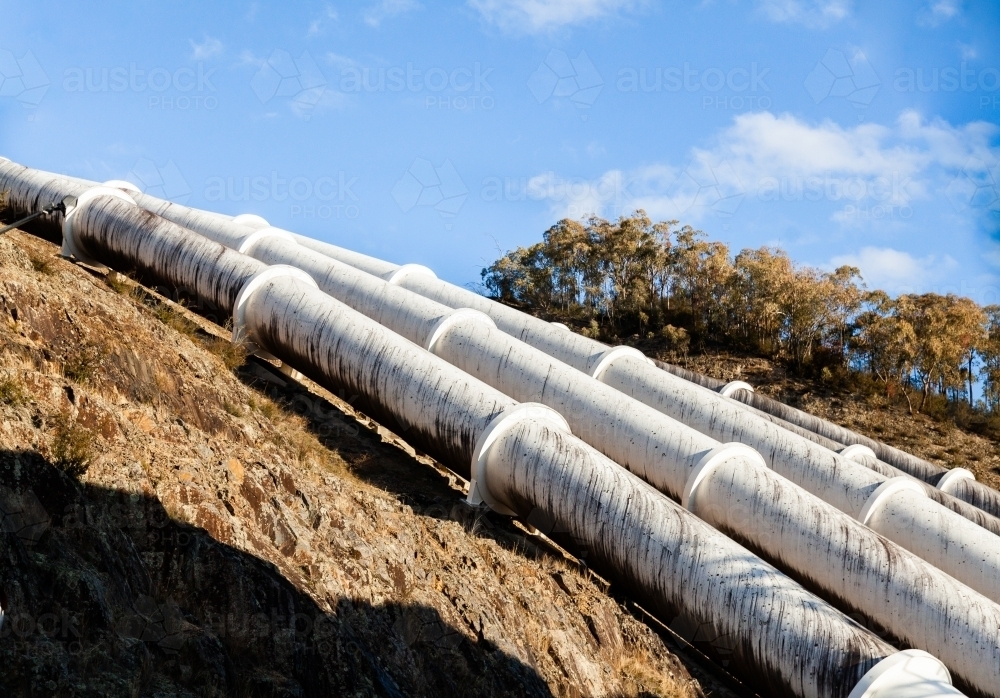 Pipes going down hill to Tumut 3 Power Station part of the snowy mountains hydroelectric scheme - Australian Stock Image