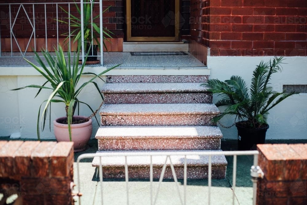 Plants chained down at front steps - Australian Stock Image