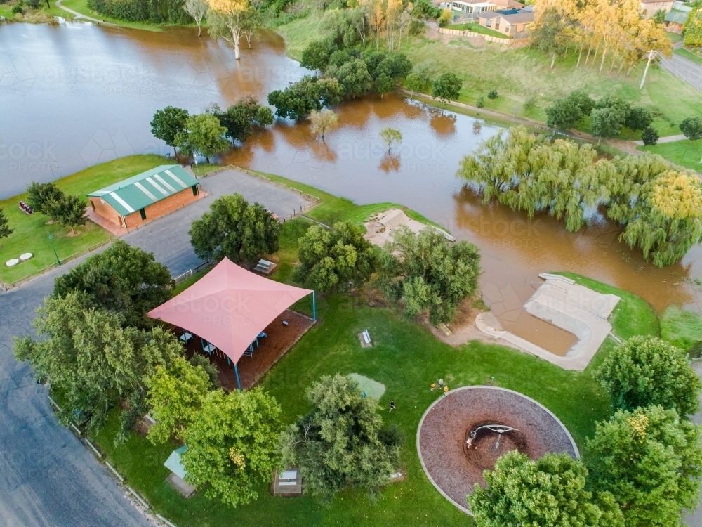Playground and skate park covered in water flooded in flash flood - Australian Stock Image