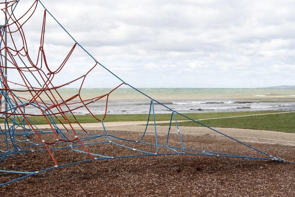 Playground net at a park by the beach side - Australian Stock Image