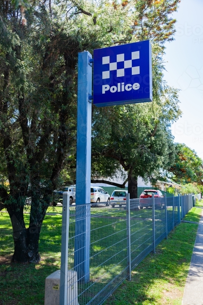 Police sign outside station along the street - Australian Stock Image