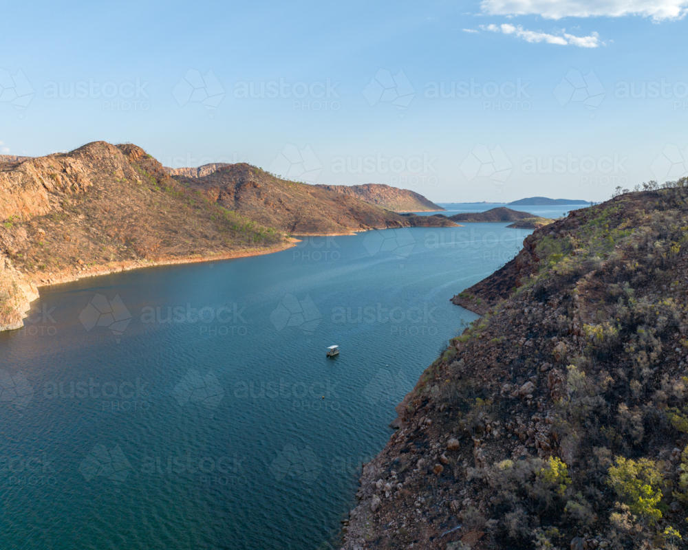 Pontoon boat cruising on Lake Argyle - Australian Stock Image