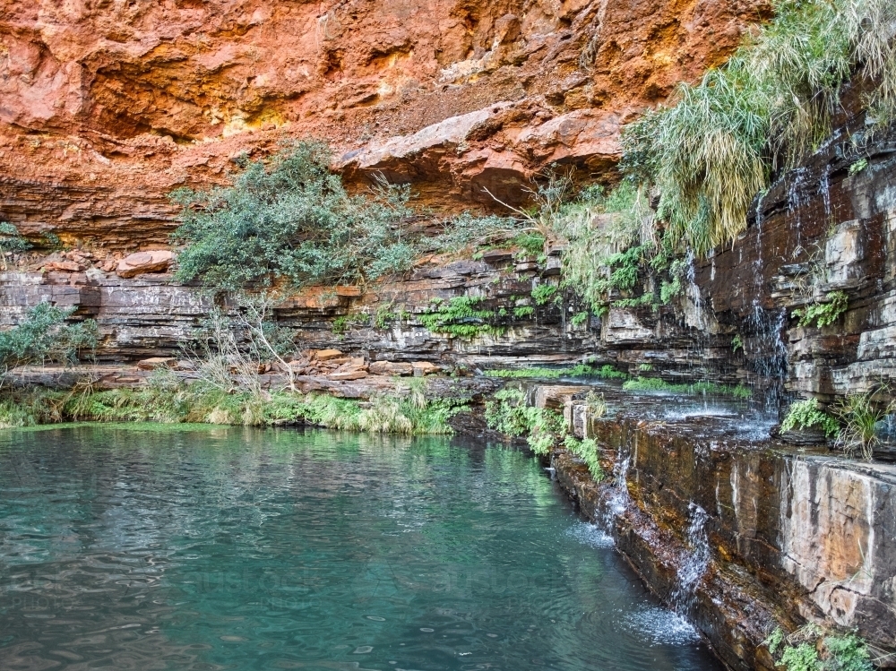Pool and waterfall in remote location - Australian Stock Image