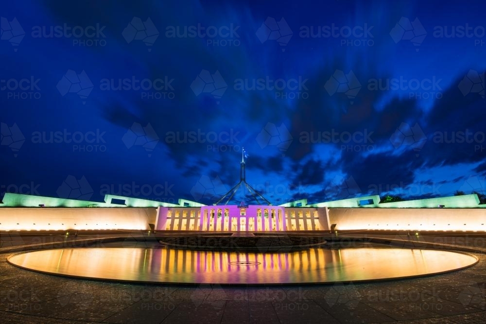 Pool of reflection at night in front of Parliament House Canberra - Australian Stock Image