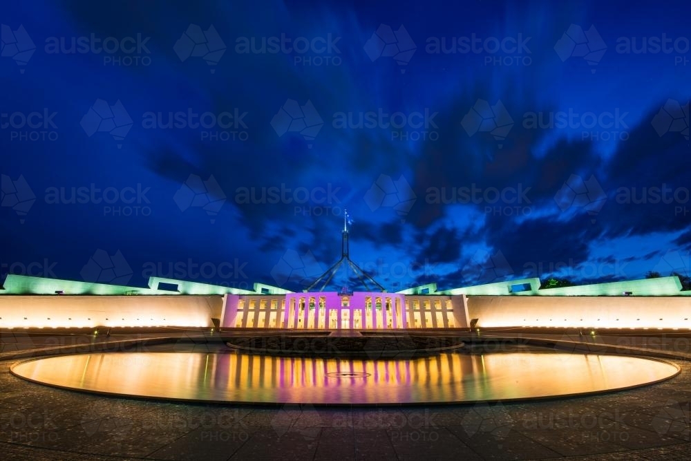 Pool of reflection at night in front of Parliament House Canberra - Australian Stock Image