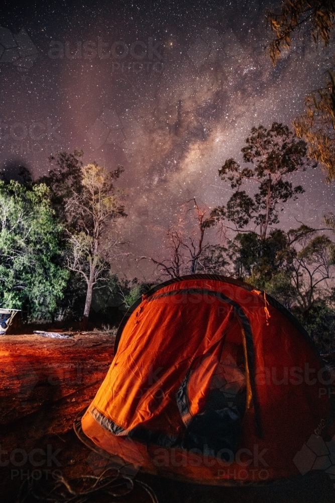 Pop up tent set up in the bush with a starry sky - Australian Stock Image
