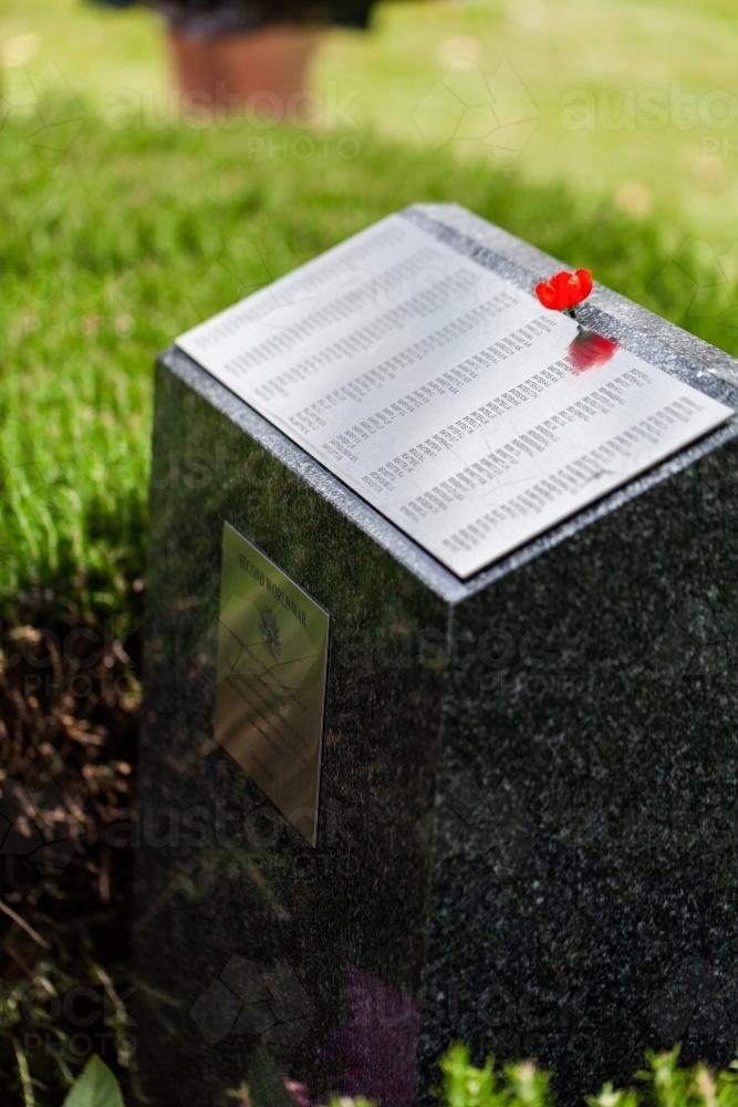 Poppy flower on WW2 memorial plinth on remembrance day in Singleton - Australian Stock Image