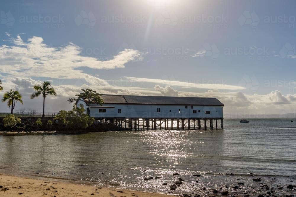 Port Douglas Sugar Wharf jutting into the bay on stilts - Australian Stock Image