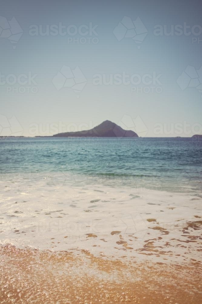 Port Stephens beach on the NSW Mid North Coast. Focus on bubbles in foreground - Australian Stock Image