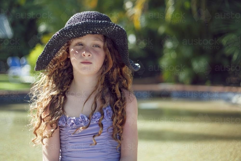 Portait of girl wearing a sunhat in Summer - Australian Stock Image
