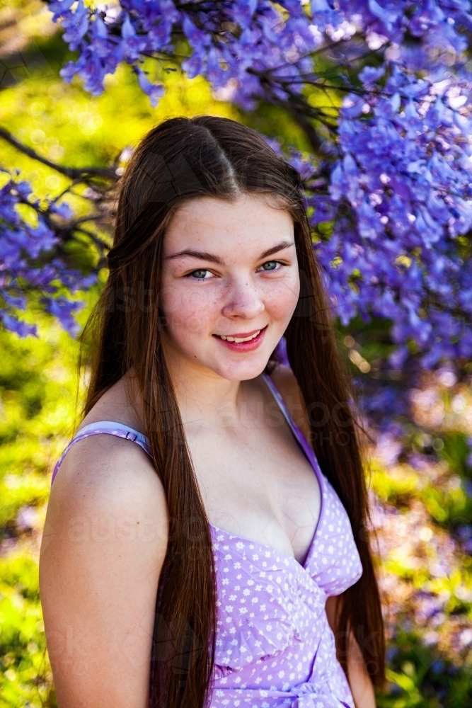 Image of Portrait of a 14yo teen girl with hazel eyes - purple and green -  Austockphoto