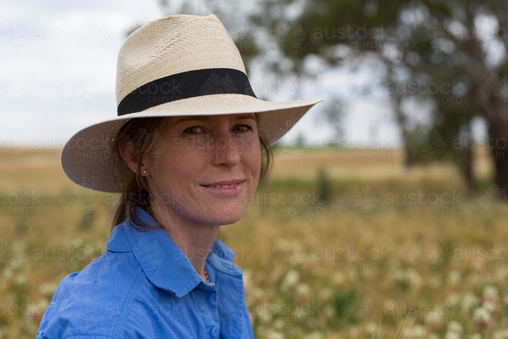 Portrait of a female farmer standing in a paddock - Australian Stock Image