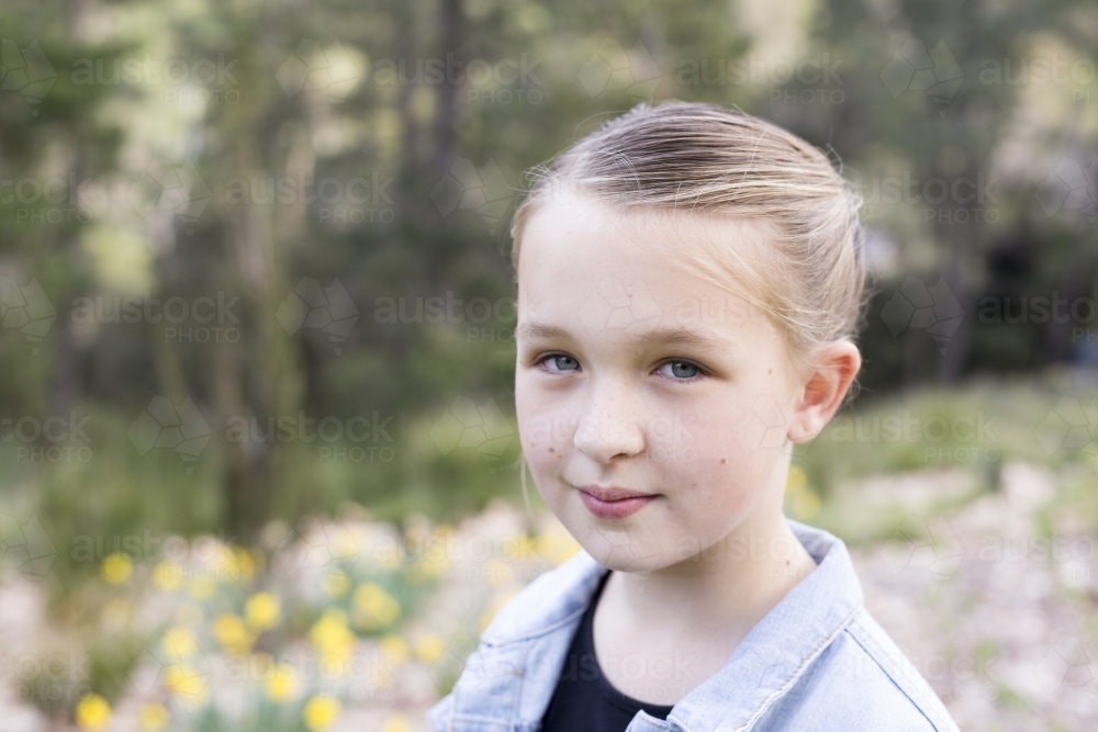Portrait of a girl standing outdoors - Australian Stock Image
