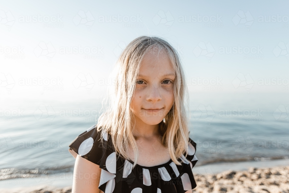 Portrait of a girl with blonde hair at the beach - Australian Stock Image