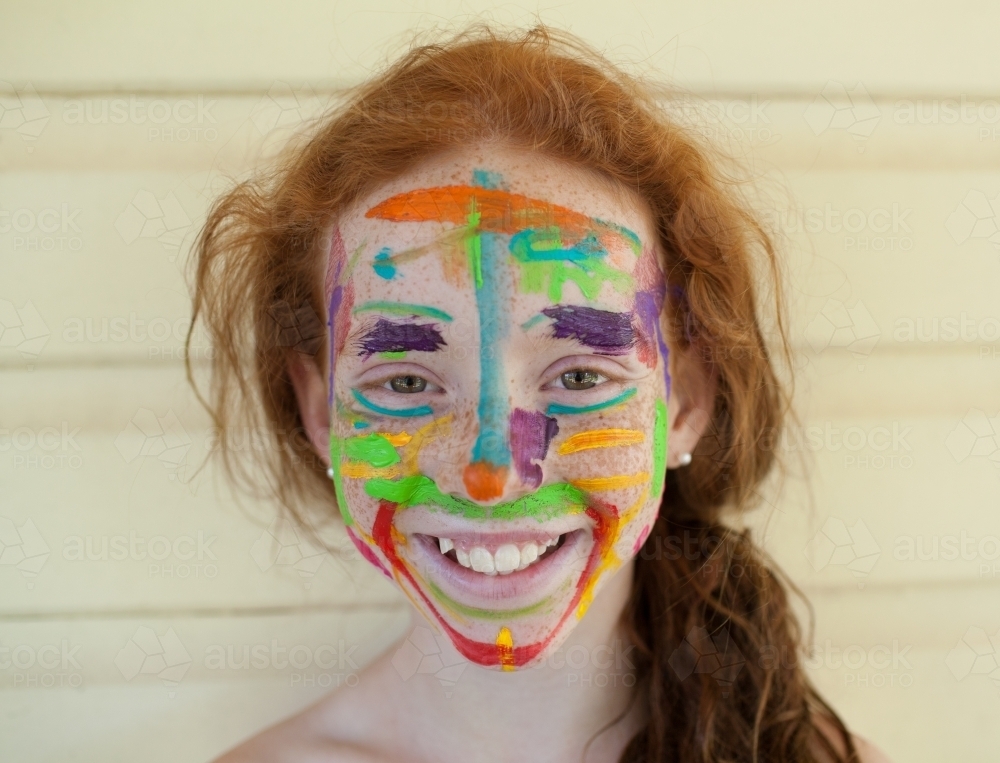 Portrait of a girl with paint on her face - Australian Stock Image