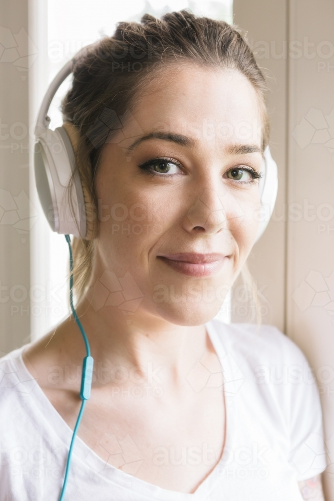 Portrait of a gorgeous young girl with headphones - Australian Stock Image