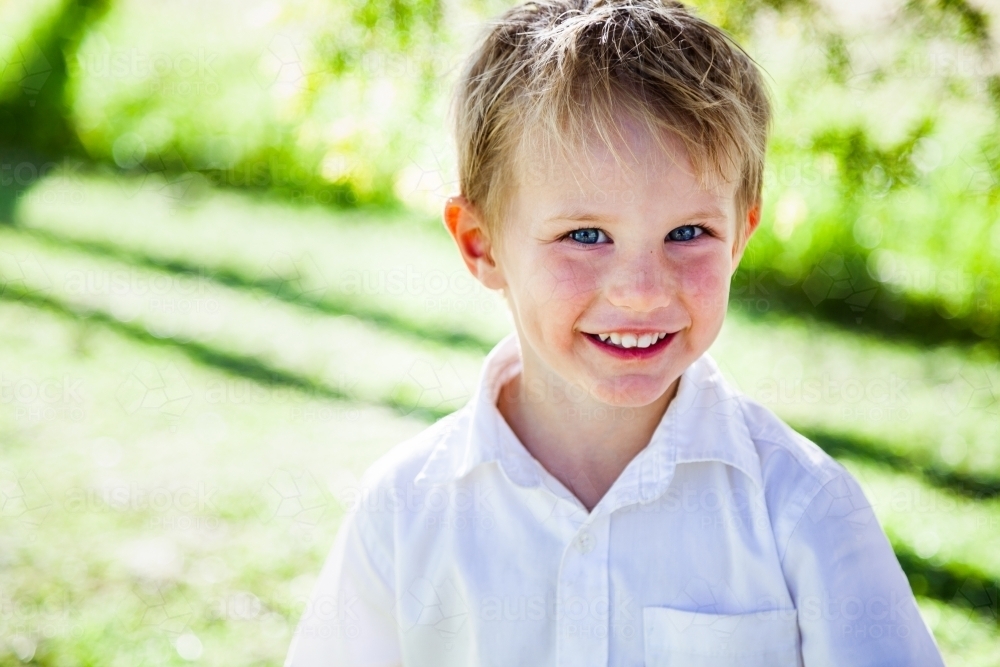 Portrait of a happy little boy smiling - Australian Stock Image