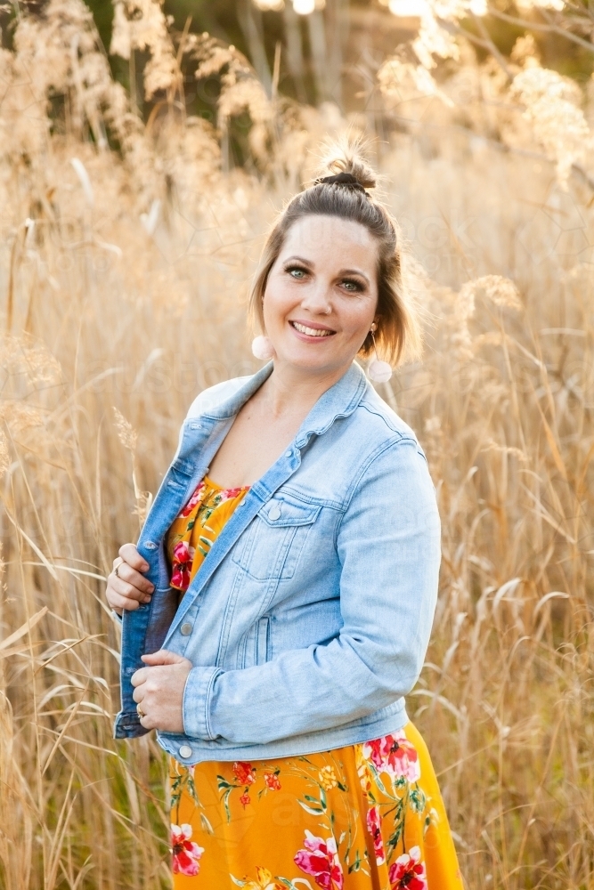 Image of Portrait of a happy thirty something year old woman outside ...