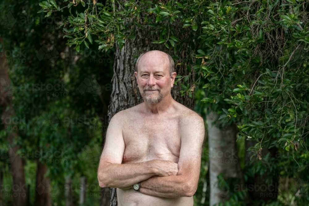 Portrait of a male breast cancer survivor standing outdoors - Australian Stock Image