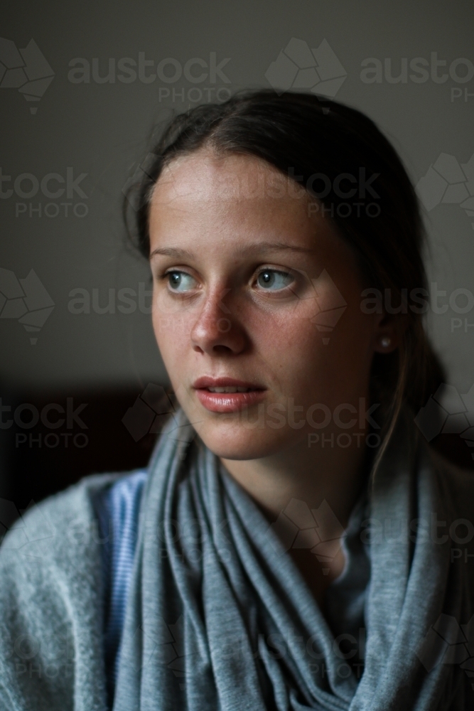 Portrait of a serious young teenage girl indoors - Australian Stock Image