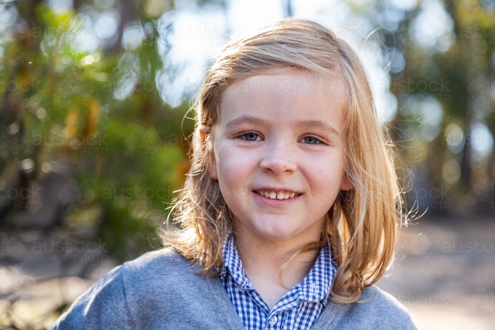 Image Of Portrait Of A Seven Year Old Boy With Long Hair Outside