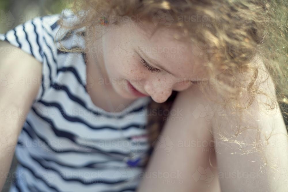 Portrait of a shy girl with freckles - Australian Stock Image