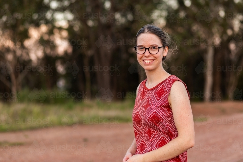 Portrait of a smiling young woman in her early twenties - Australian Stock Image
