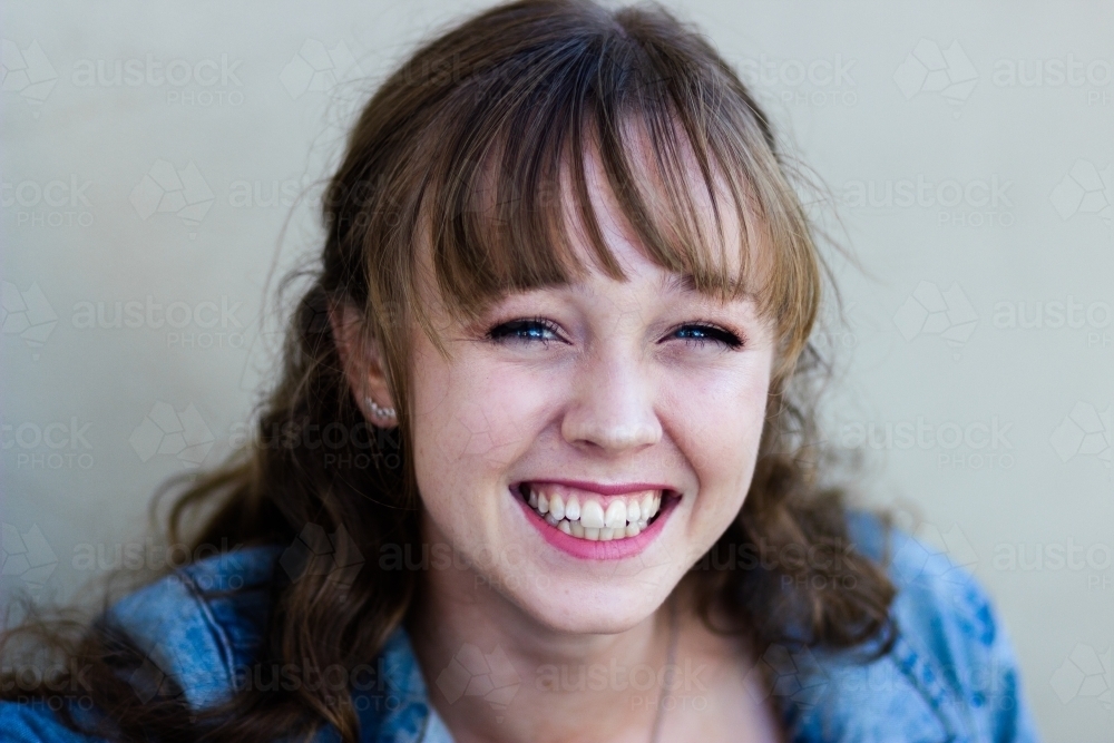 Portrait of a smiling young woman in her late teens - Australian Stock Image