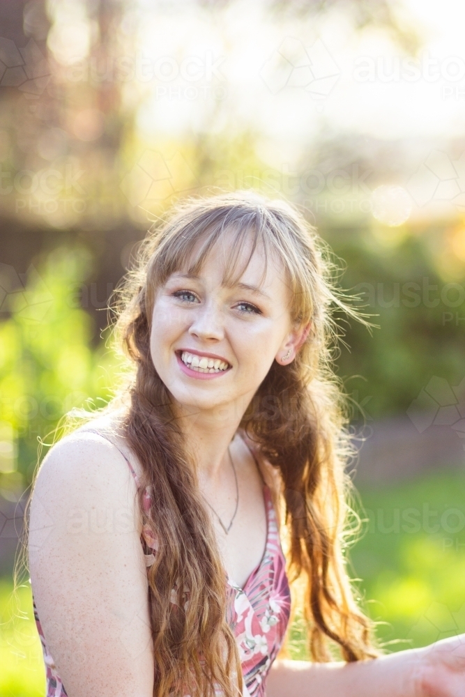 Portrait of a smiling young woman in her late teens - Australian Stock Image